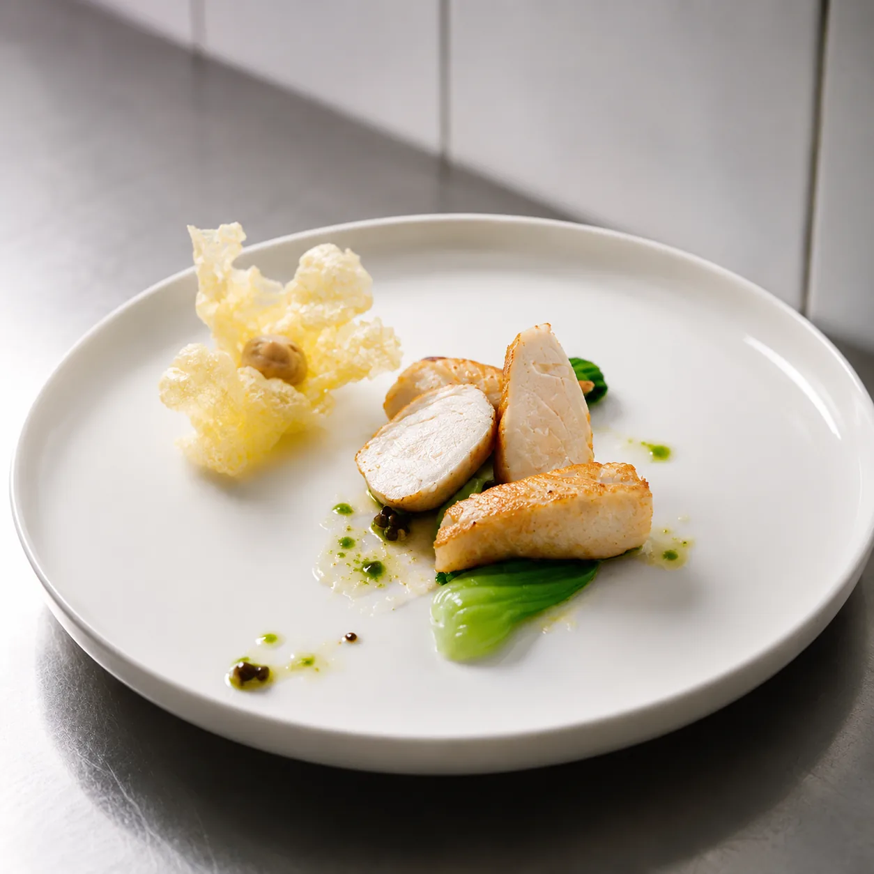 Sliced chicken with bok choy and parmesan crisp