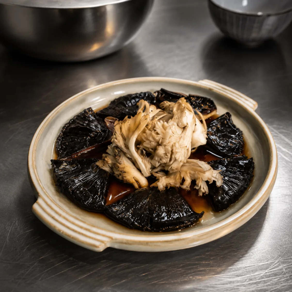 Black garlic petals with maitake mushroom and dashi