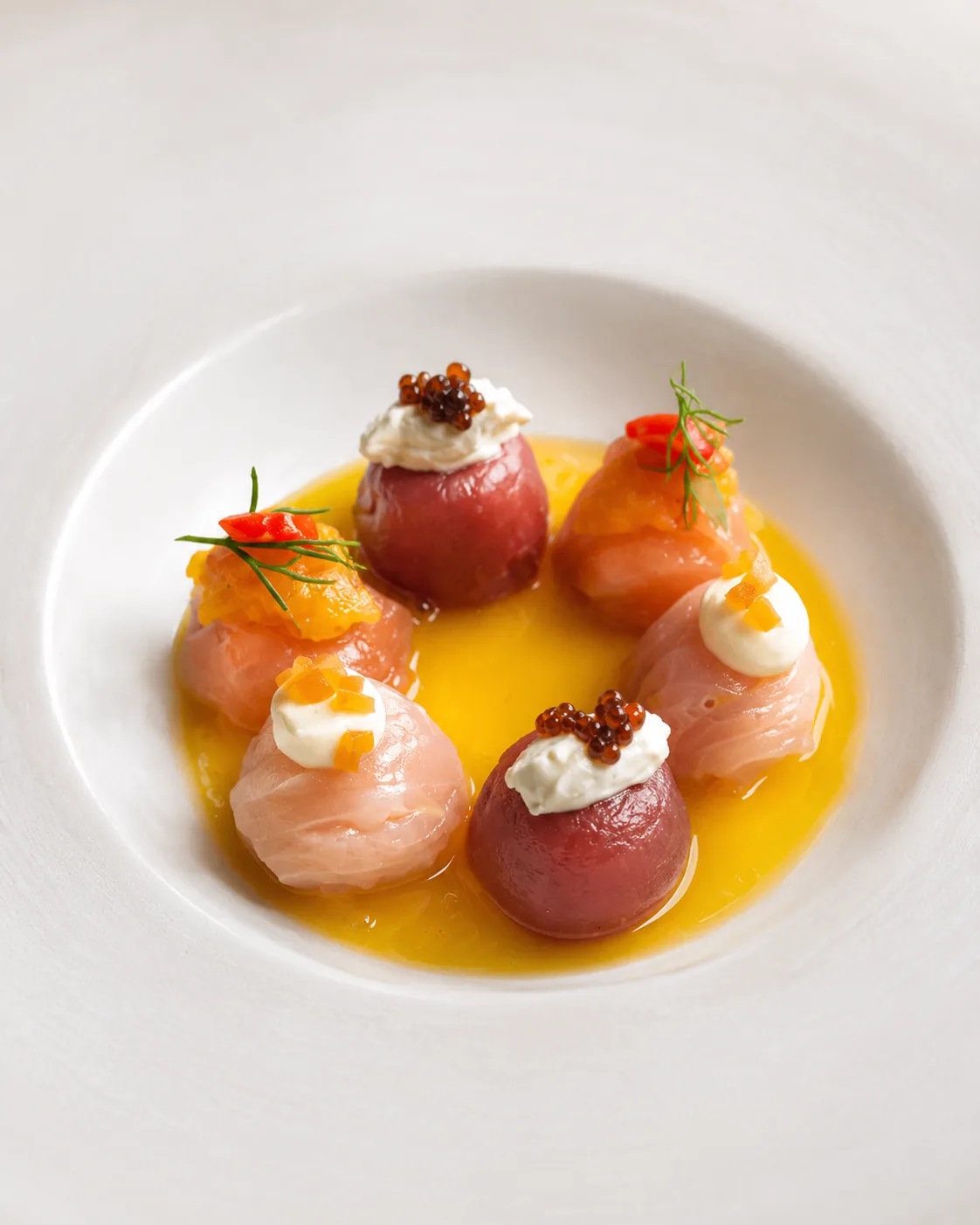 Delicate amberjack and tuna bites in citrus emulsion