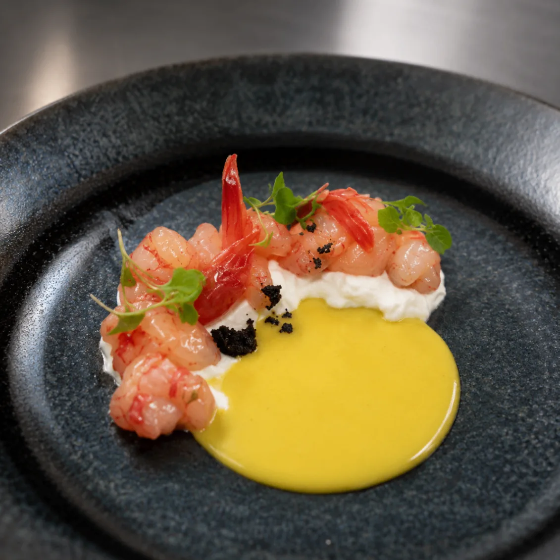 Sweet prawn crudo with saffron-yellow sauce
