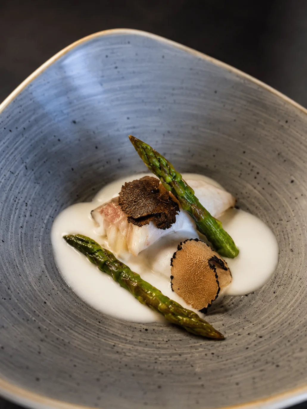 White fish with asparagus, truffle, and velvety cream sauce